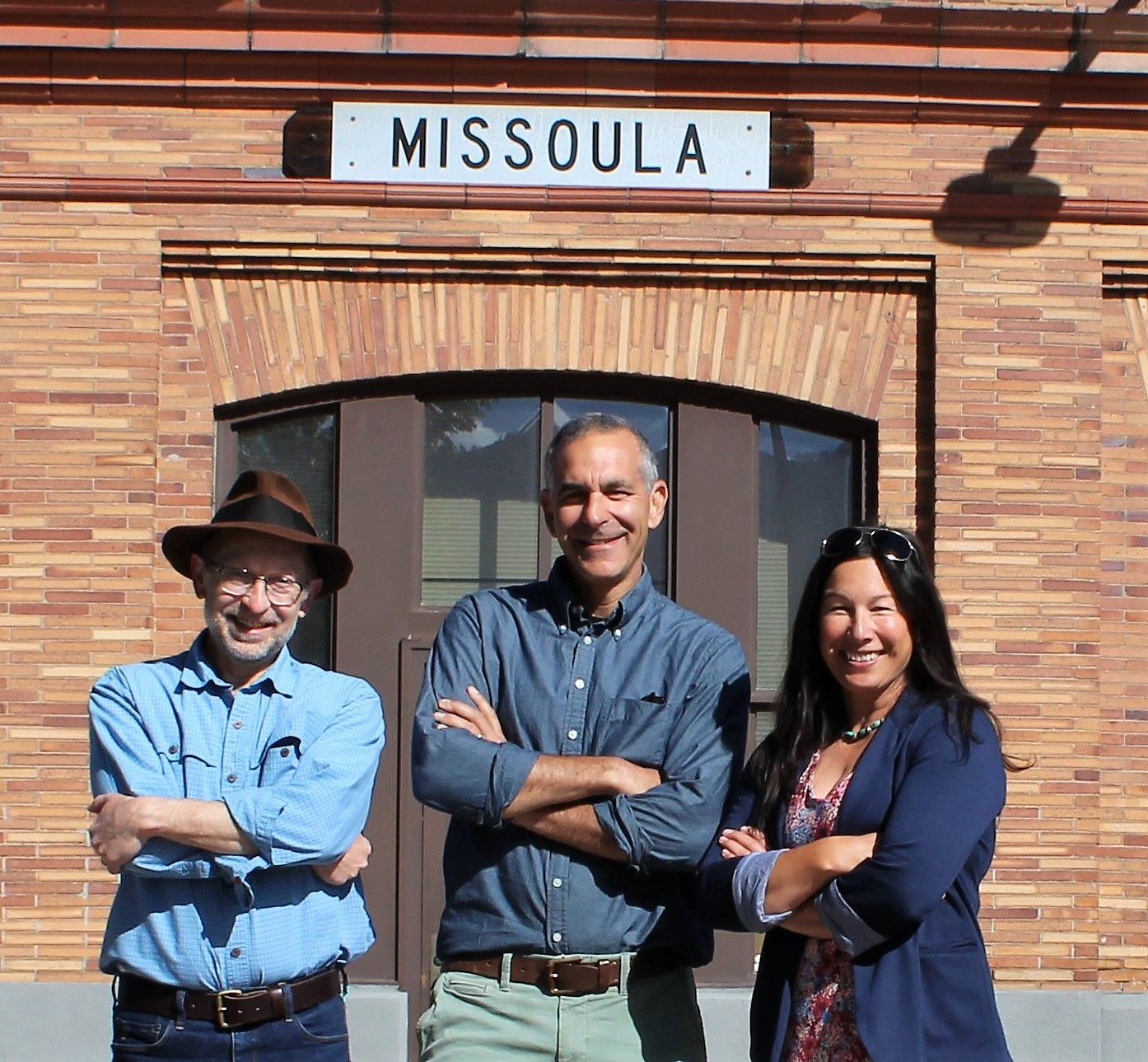 Commissioners standing in front of the former railroad depot